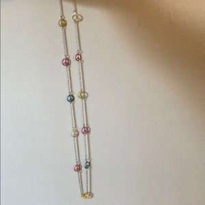 Long peace sign necklace.
